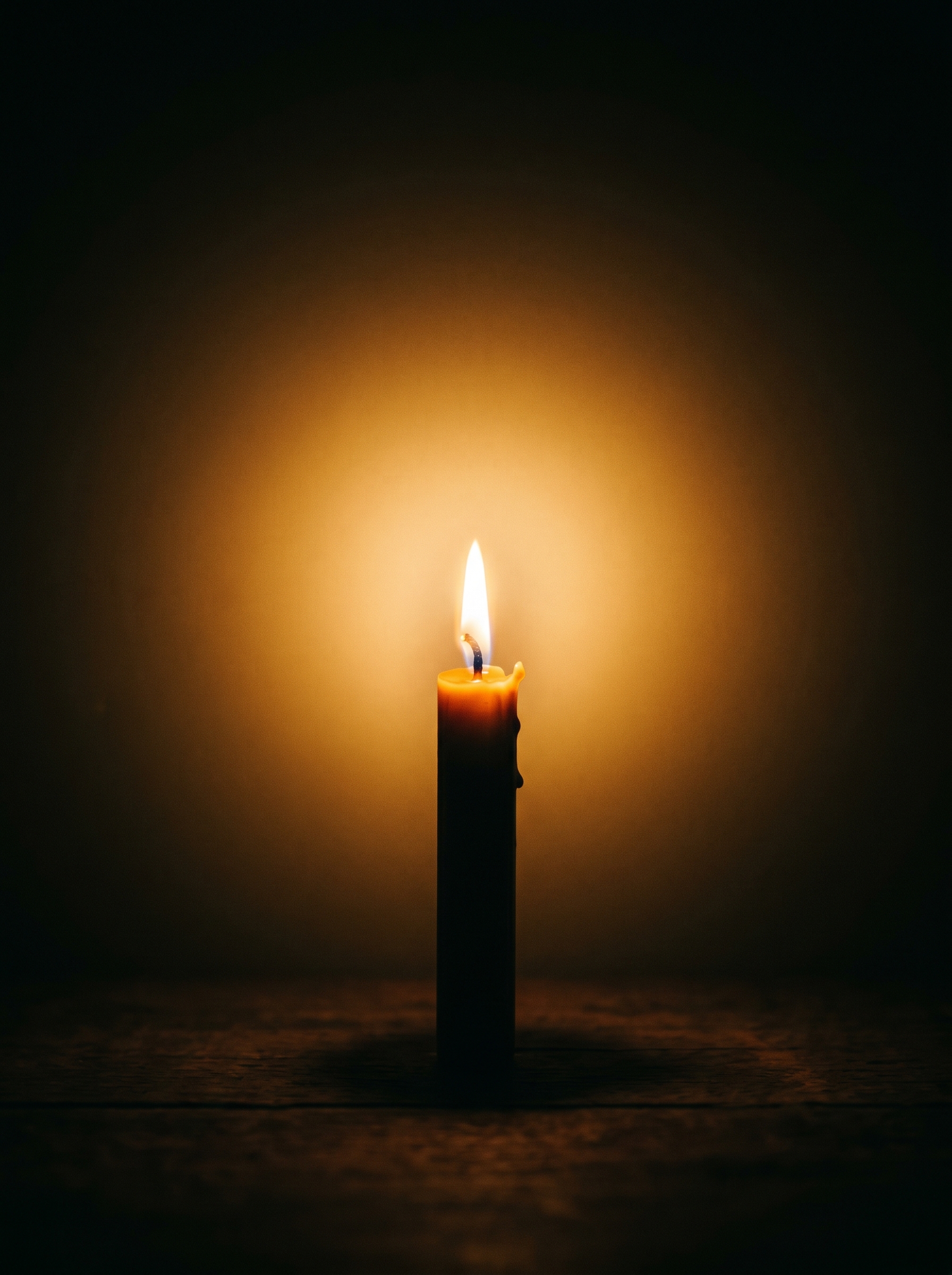 Single candle in complete darkness — light disproportionate filling frame, flame impossibly present for its size, consciousness as light, small source infinite reach